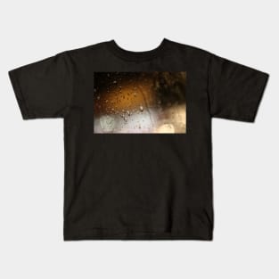 Deatil of raindrops on a car windshield at night Kids T-Shirt